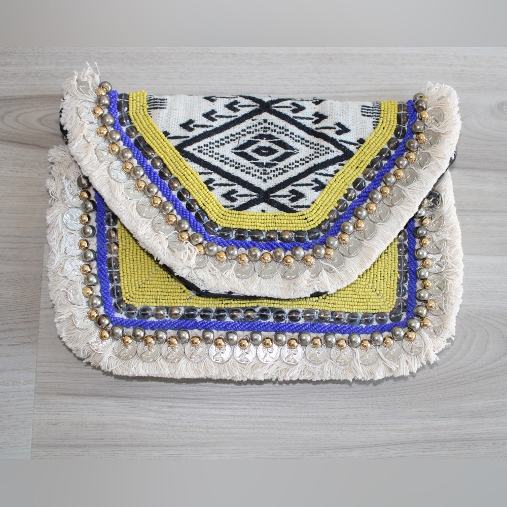 Boho Clutch/crossbody bag . It has chain in it to use it as a crossbody bag